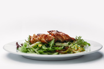 slices of sliced Turkey with salad on a white background