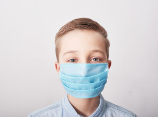 Child in medical mask. Coronavirus and Air pollution pm2.5 concept. Virus symptoms. Concept of epidemic, influenza, protection from disease, vaccination. Flu illness. Medical care. Insurance.
