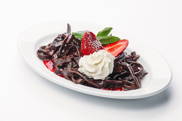 dessert of whipped cream and strawberries on a white background