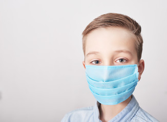 Child in medical mask. Coronavirus and Air pollution pm2.5 concept. Virus symptoms. Concept of epidemic, influenza, protection from disease, vaccination. Flu illness. Medical care. Insurance.