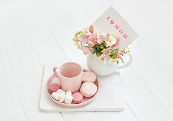 Obraz na płótnie Canvas Mother's Day Greeting Card. Romantic breakfast. Happy mothers day frame background. Tea set with flowers and sweet. Spring card template. Happy Birthday or Valentine. Women's Day. Copy space.