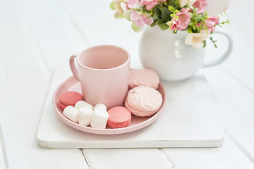 Mother's Day Greeting Card. Romantic breakfast. Happy mothers day frame background. Tea set with flowers and sweet. Spring card template. Happy Birthday or Valentine. Women's Day. Copy space.