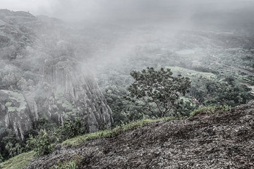 View on volcano from the top of Puncak gunung in fog
