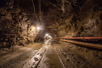 Underground gold quartz mine shaft tunnel drift with light