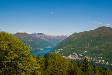 Fototapeta premium View of the Parco San Grato in Lugano, Switzerland. Alpine mountain scenery on a sunny summer day and views of Lake Lugano. 