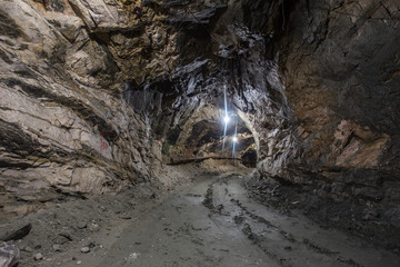 Underground gold quartz mine shaft tunnel drift with light