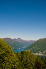 View of the Parco San Grato in Lugano, Switzerland. Alpine mountain scenery on a sunny summer day and views of Lake Lugano. 