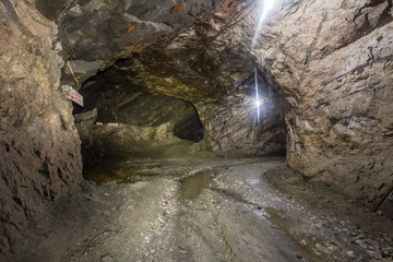 Underground gold quartz mine shaft tunnel drift with light