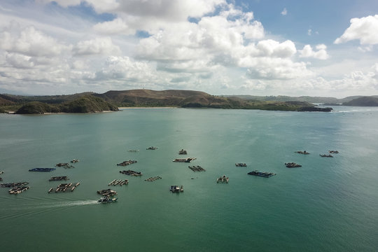 Aerial view of traditional floating fishing cages, Gerupuk Bay, Lombok, Indonesia