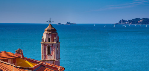 Bell tower of the church of Tellaro and Portovenere on the background in the Gulf of Lerici Liguria Italy