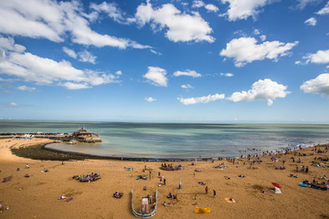 Fototapeta na wymiar Golden sand of Viking Bay Broadstairs, Thanet, Kent, UK and the historic Bleak House on a sunny summer day.Broadstairs Kent England.June 28 2018