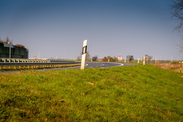 Fototapeta premium Empty road near Berlin airport with blue sky.