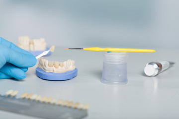 Close up of shade guide to check veneer of tooth crown in a dental laboratory for bleaching 
