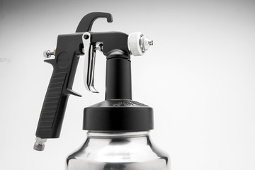 A spray gun on a white background