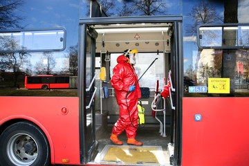 Mulicipality workers emergency brigade disinfecting public transport during Corona virus outbreak...