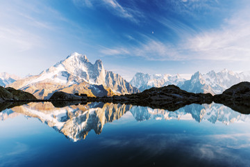 Incredible view of clear water and sky reflection on Lac Blanc lake in France Alps. Monte Bianco mountains range on background. Landscape photography, Chamonix.