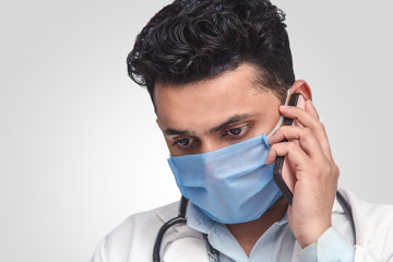 Male doctor on the phone