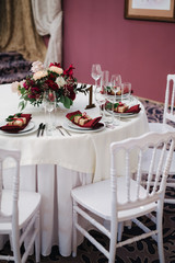 elegant table setting; wedding table setting in red colors; сhristmas table setting