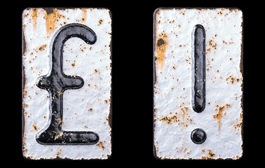 Set of symbols pound and exclamation point made of forged metal on the background fragment of a metal surface with cracked rust.