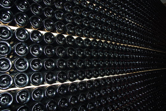 View of wine bottle bottoms wall. Wine cellar. Wine storage.