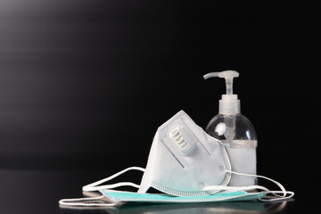 Sanitizer gel or antibacterial soap and face mask for Covid-19 coronavirus preventive
