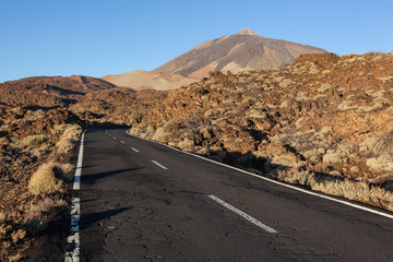 Old highway through volcanic lava fields in the Teide National Park, Tenerife, Canary Islands, Spain.