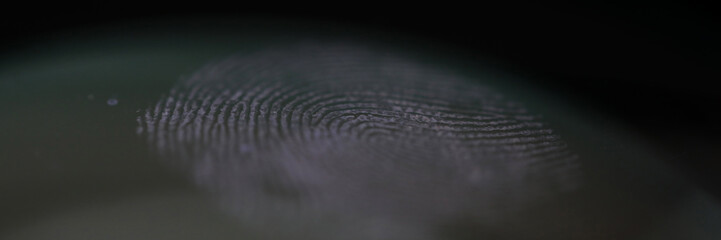 Fingerprint mark on clear glass as crime evidence