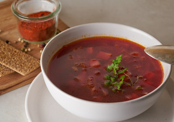 Vegan red soup in white plate
