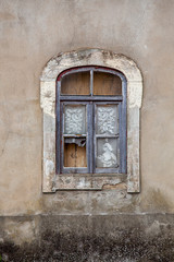 Fototapeta na wymiar Old window and broken glass with curtains.