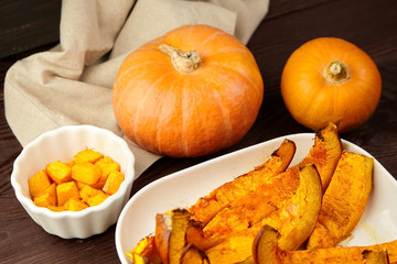 Slices of baked pumpkin in white ceramic bowl