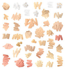 Fototapeta premium Set with different sticking plasters on white background, top view