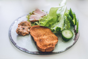 sandwiches with toasted bread, pork, herbs, iceberg lettuce on a white isolated background