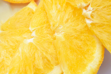 Fresh juicy sliced orange slices on a white background.
