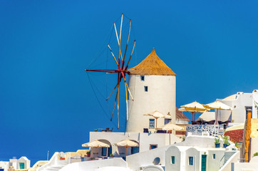 windmill on santorini island against blue sky