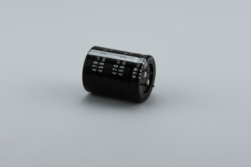 High voltage electrolytic capacitor isolated on white background
