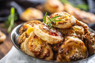 Pizza rolls stuffed with various ingredients, prosciutto bacon spinach basil mozzarella or parmesan cheese
