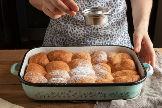 Buchty - Czech sweet buns made of yeast dough - dusting with sugar