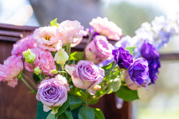 Bouquets of fresh flowers decoration of the festive table. Celebrating an open air party. Decor Details