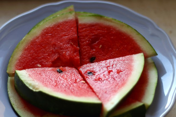 Slices of watermelon on a plate. Selective fcous.