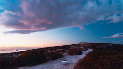 Obraz premium Long exposure sunset at Calamosca hill, walking path, sunset and blue hour