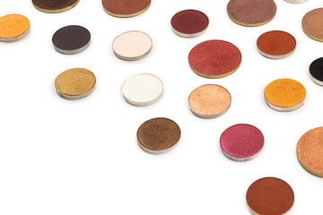 Round multicolored make up eyeshadows isolated on white.