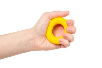 Yellow and orange expander in woman hand isolated on white background.