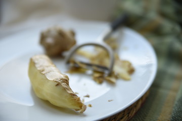 Preparing a sweet hot drink with ginger, lemon and honey for easing cold symptoms and feeling better  M