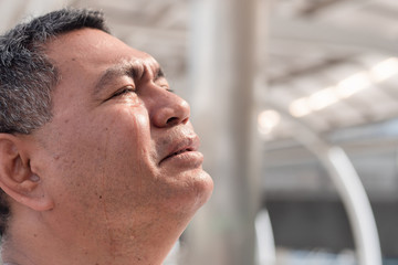 Obraz premium sad old senior man crying; portrait of asian man in senior uncle age crying for sorrow, failure, problem, sad event, grief, unhappiness, frustration in life, bad days, failed life