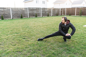 A guy doing workout in the backyard