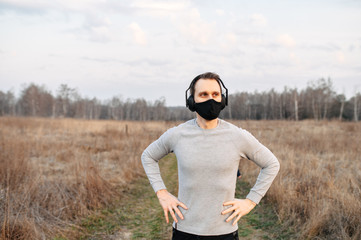 Healthy lifestyle. Guy in a black medical mask