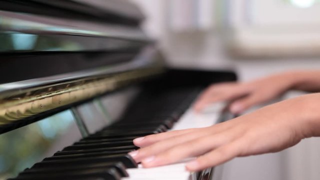 close up of someone playing piano