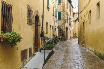 Fototapeta premium Walk on a rainy day through the streets of the beautiful town, Pienza, Tuscany