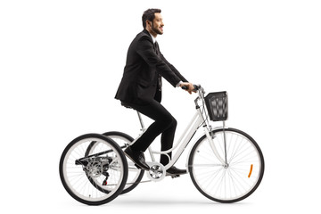 Businessman riding a tricycle