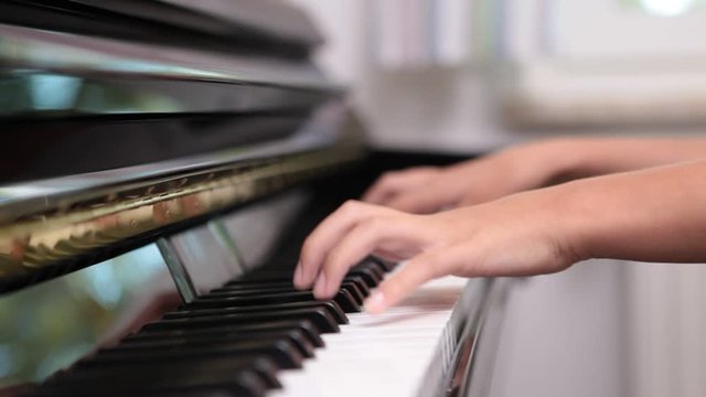 close up of someone playing piano